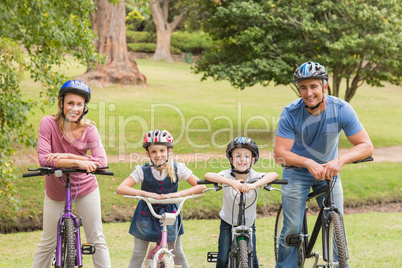 Happy family on their bike at the park