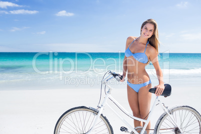 Pretty blonde woman going on a bike ride