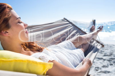 Brunette relaxing in the hammock