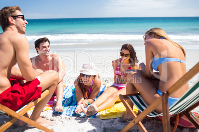 Happy friends sunbathing together