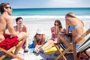 Happy friends sunbathing together