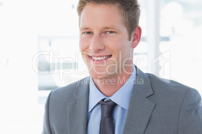 Smiling businessman looking at camera