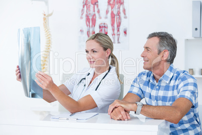 Doctor showing X rays to her patient