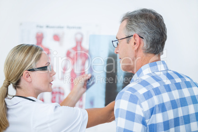 Doctor showing X rays to her patient