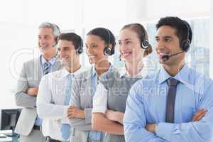 Business people with headsets looking at right