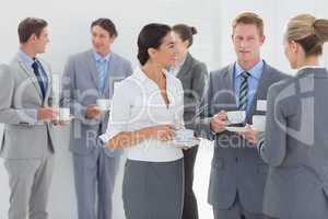 Business people drinking cup of coffee