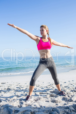 Fit blonde woman doing yoga