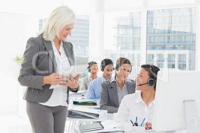 Businesswoman speaking with her colleagues