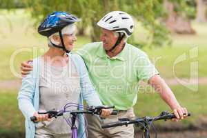 Happy senior couple on their bike
