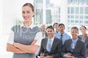 Business people looking at camera with arms crossed