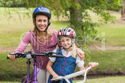 Mother and her daughter on their bike