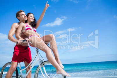 Happy couple going on a bike ride