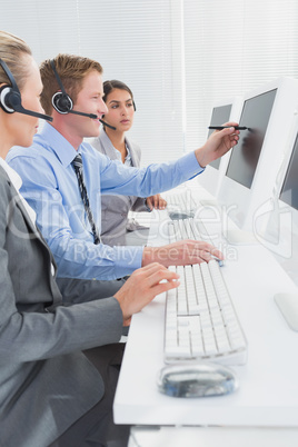 Businessman showing his screen to the team