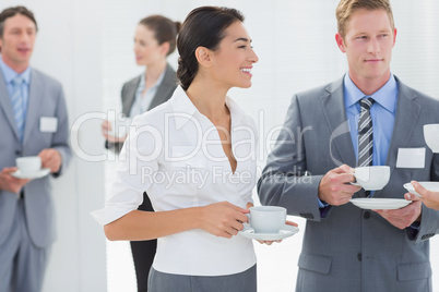 Business people drinking cup of coffee