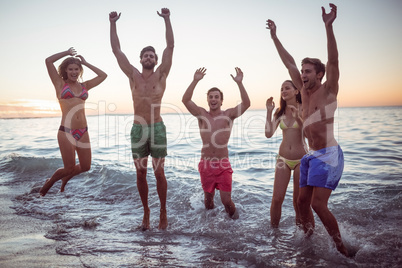 Happy friends having fun in the water