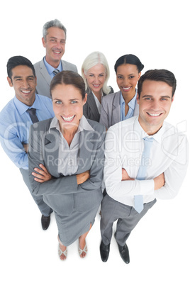 Smiling business people looking at camera with arms crossed