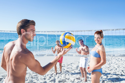 Friends playing volleyball