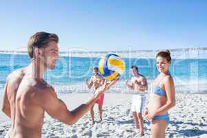 Friends playing volleyball