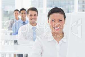 Smiling work team using computer
