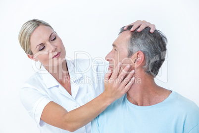 Doctor doing neck adjustment