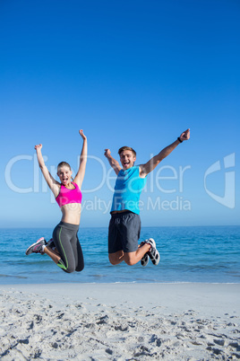 Happy couple jumping together