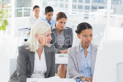 Businesswoman checking her colleagues works