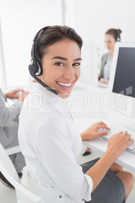 Smiling businesswoman wearing headset