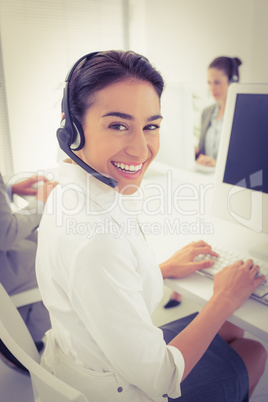 Smiling businesswoman wearing headset