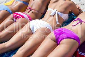 Girls in bikini sunbathing