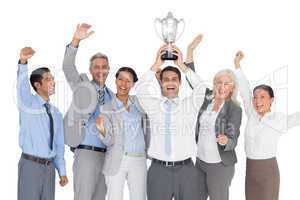 Business people holding cup and cheering