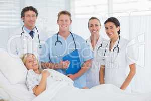 Team of doctor and patient looking at camera