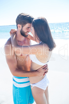 Happy couple hugging and smiling at each other Happy couple hugging and smiling at each other