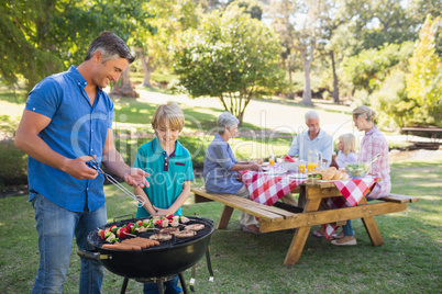 Happy family having picnic in the park