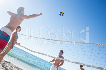 Friends playing volleyball