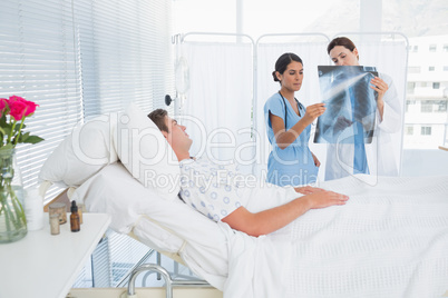 Doctors examining patients xray