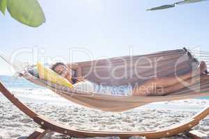 Brunette relaxing in the hammock