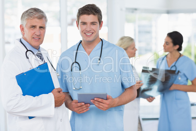 Team of smiling doctors discussing