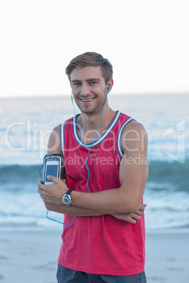 Handsome runner looking at camera