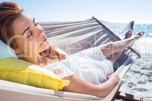 Brunette relaxing in the hammock