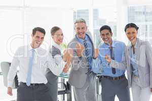 Business people cheering in office