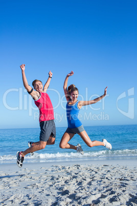 Happy couple jumping together