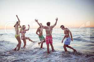 Happy friends having fun in the water