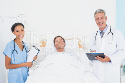 Doctor with colleagues and patient