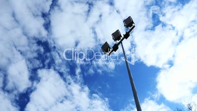 Spotlight, Stadium lights, with blue sky.