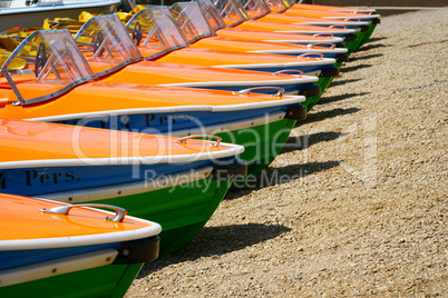 Pedal boats side by side on the shores