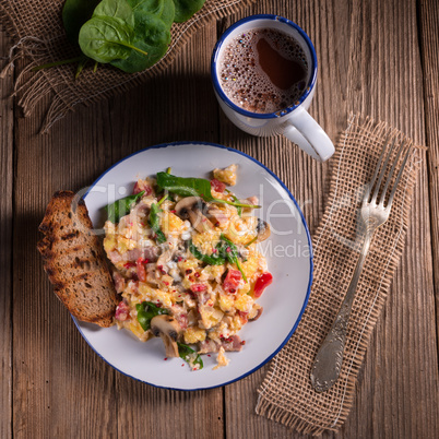 Scrambled eggs with tomatoes and spinach