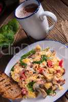 Scrambled eggs with tomatoes and spinach