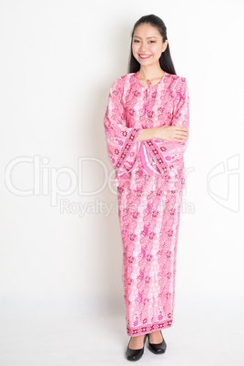 Portrait of Asian girl in pink batik dress