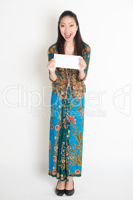 Asian female holding an envelope
