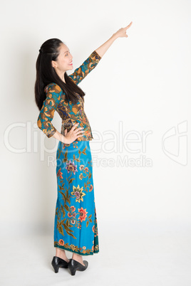 Asian female pointing